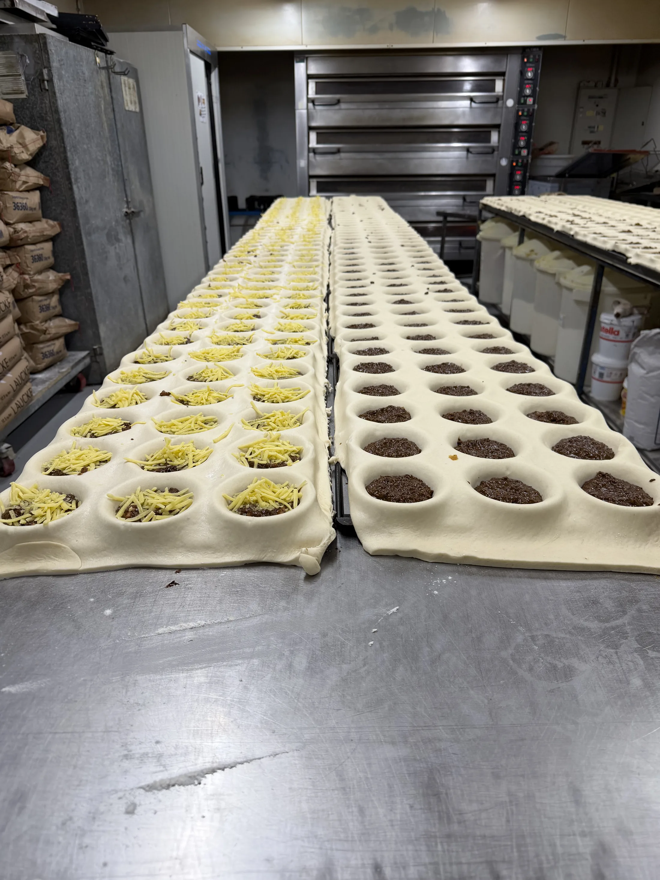 Trays of pies hand-filled fresh in the Kipling's Bakery kitchen
